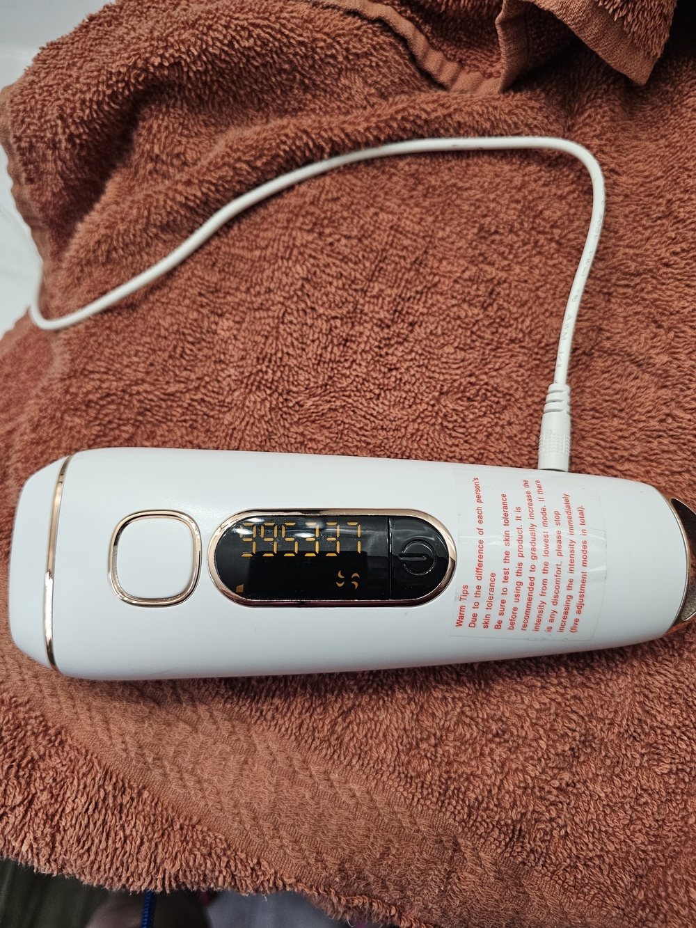 Laser Hair Removal Wand.   White Handheld Beauty Device with Gold Accents